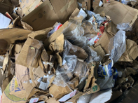 Bottles, cans and plastic wrap. Plastic milk crates. Even an office chair and a toilet seat. Cardboard contamination is not new, but it’s a much more expensive problem than it was before as can be seen in these photos.
