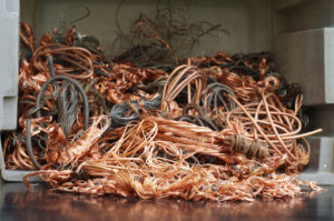 Coils of scrap copper wire in a pile ready for recycling.