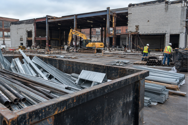 C&D scrap metal recycling for developers with sorted metal materials in a roll-off container on a Massachusetts construction site.